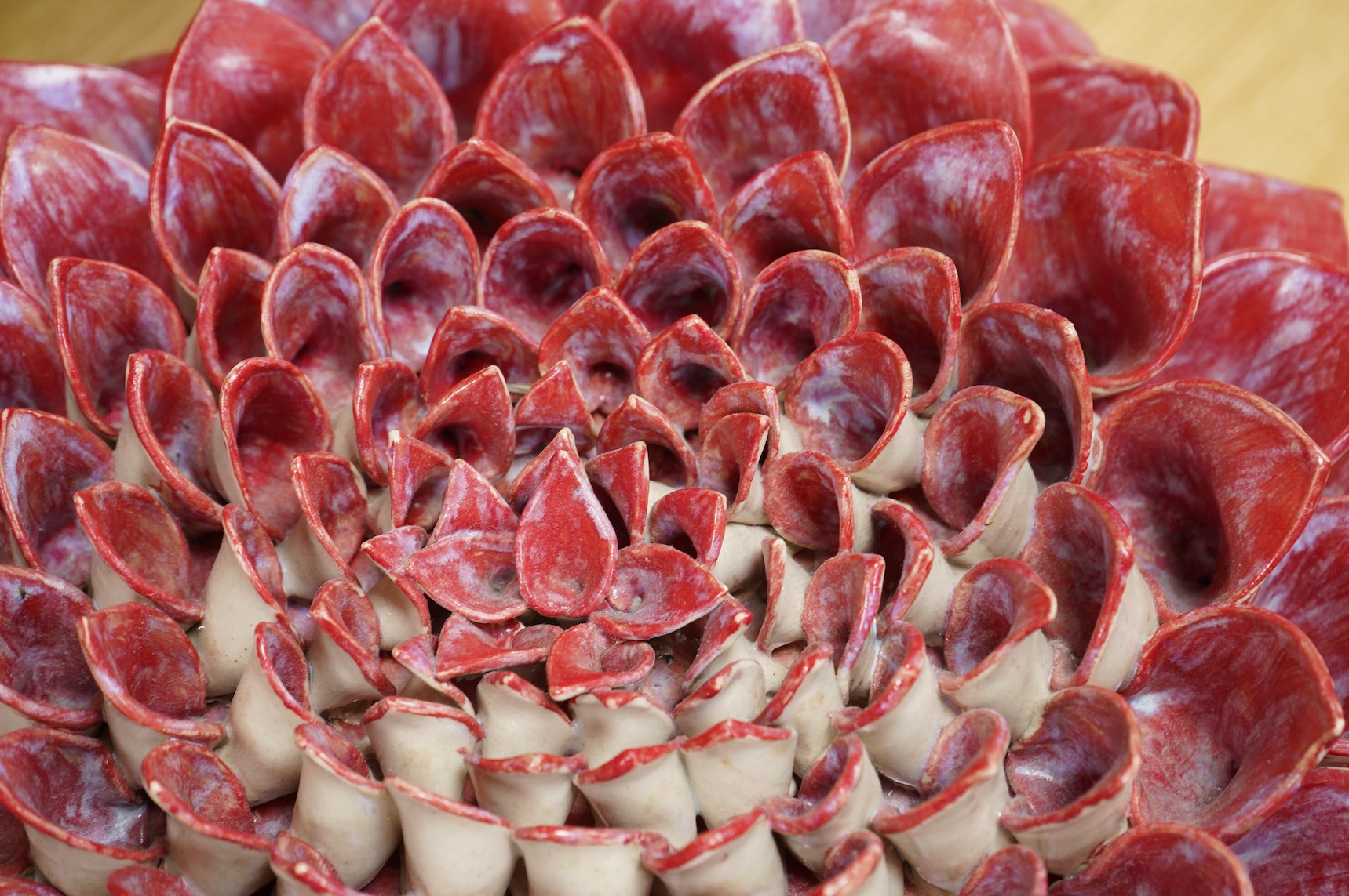 Frances Doherty, a Bishop's Pom Pom ceramic sculpture, with red glaze, 40cm wide